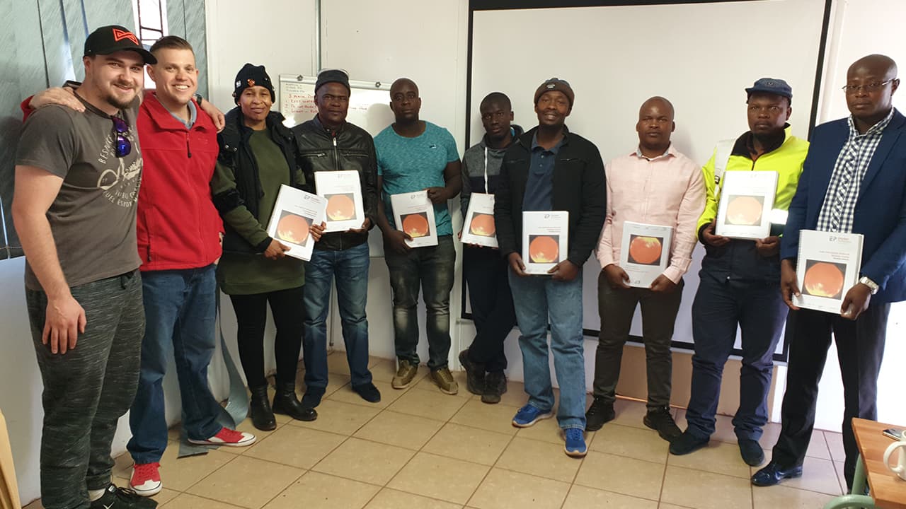 Steamwell boiler operator training graduates holding manuals